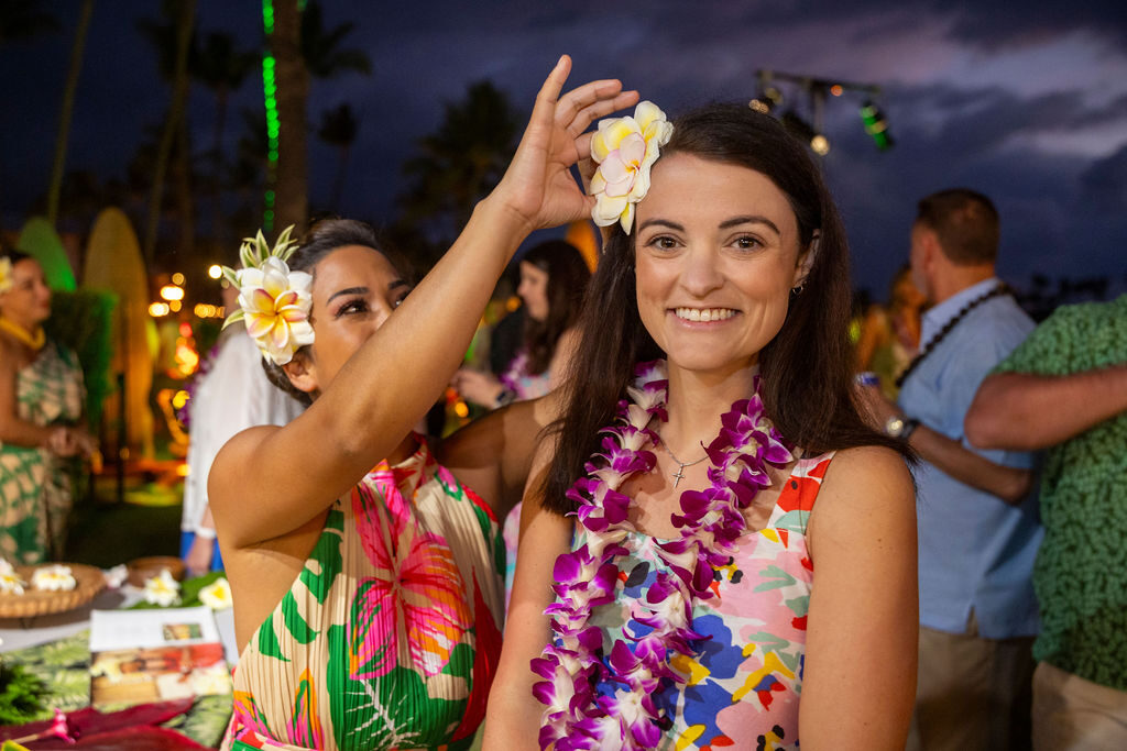 Woman with flower lei celebrating at a Hawaiian incentive trip