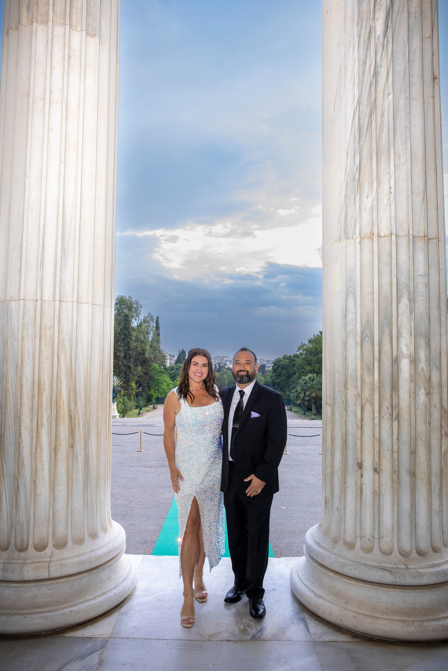 Couple standing together at a Sahliyeh event venue with marble columns